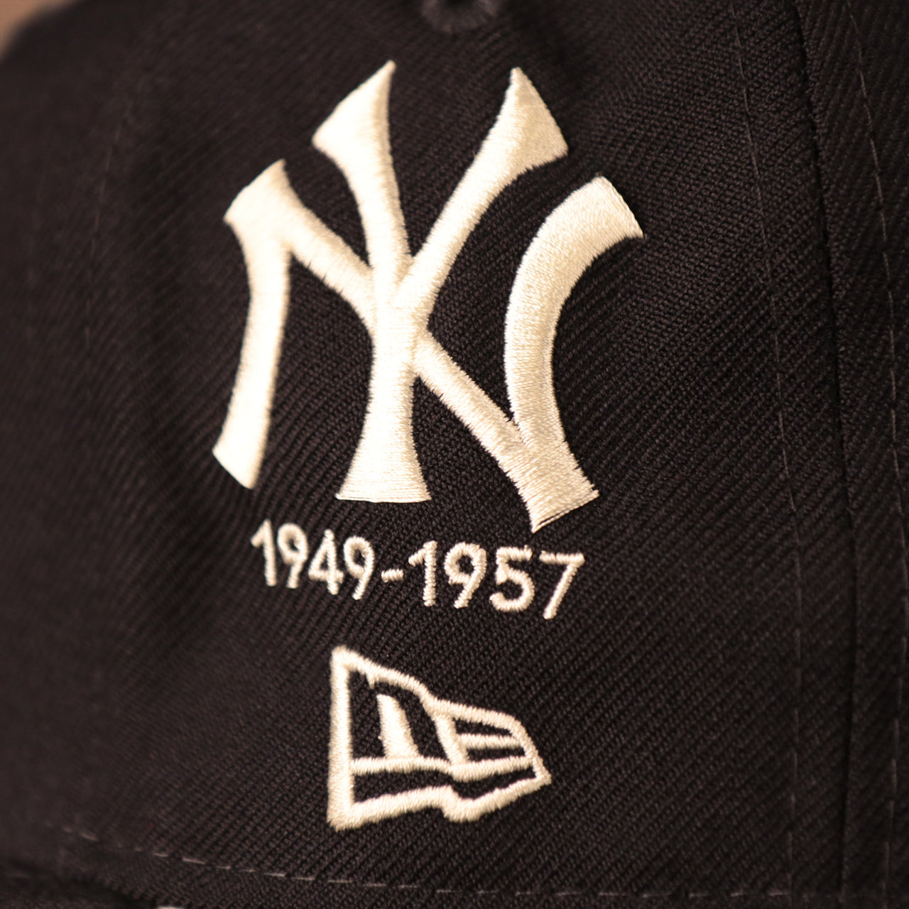 Bronx Bombers and New Era logo on the navy, logo history all-over fitted hat by New Era.
