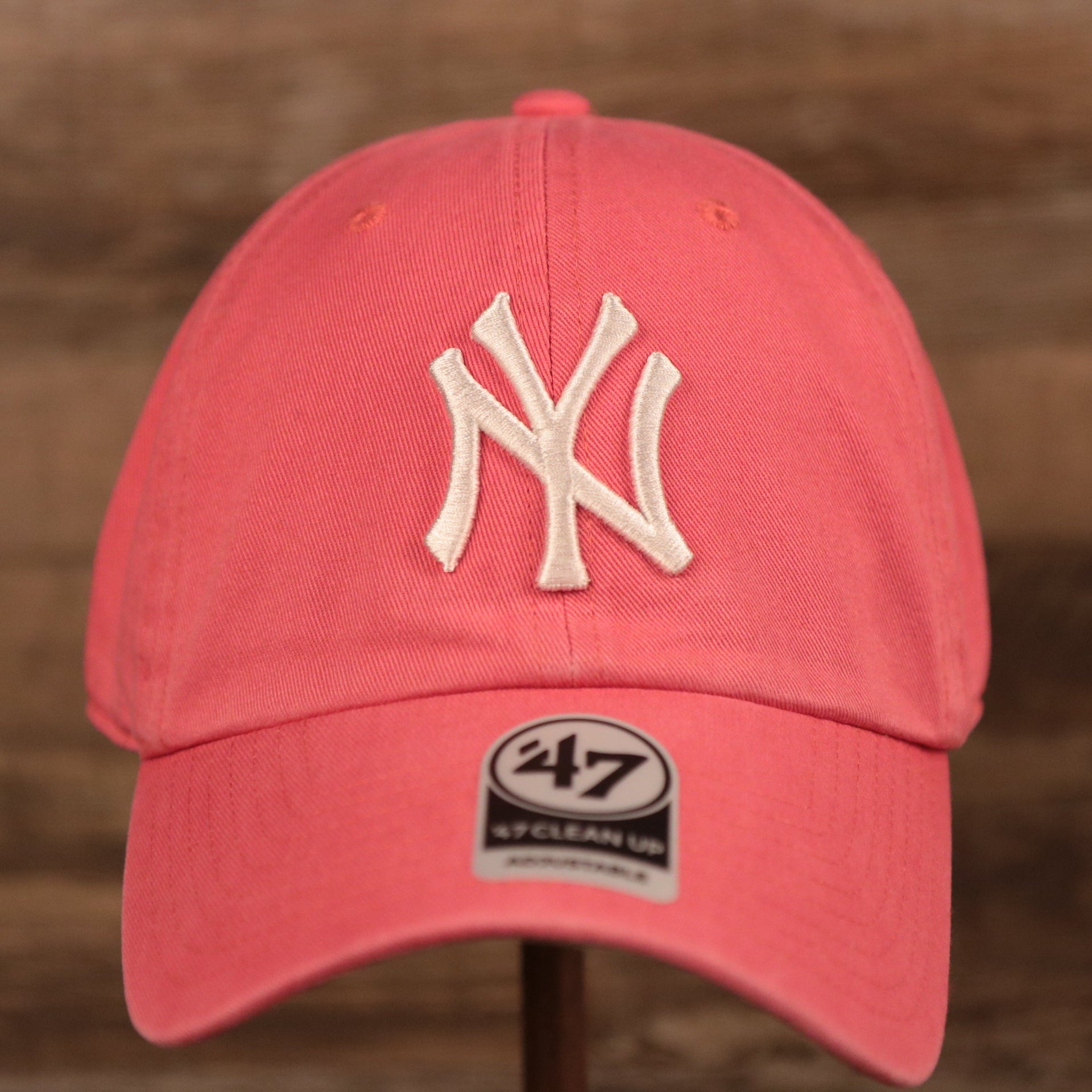 The pink adjustable New York Yankees green bottom baseball hat.