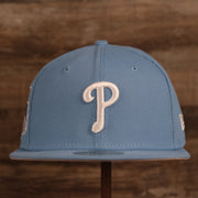 The front Phillies white logo on the MLB 1996 All Star Game ice blue vintage side patch fitted hat.