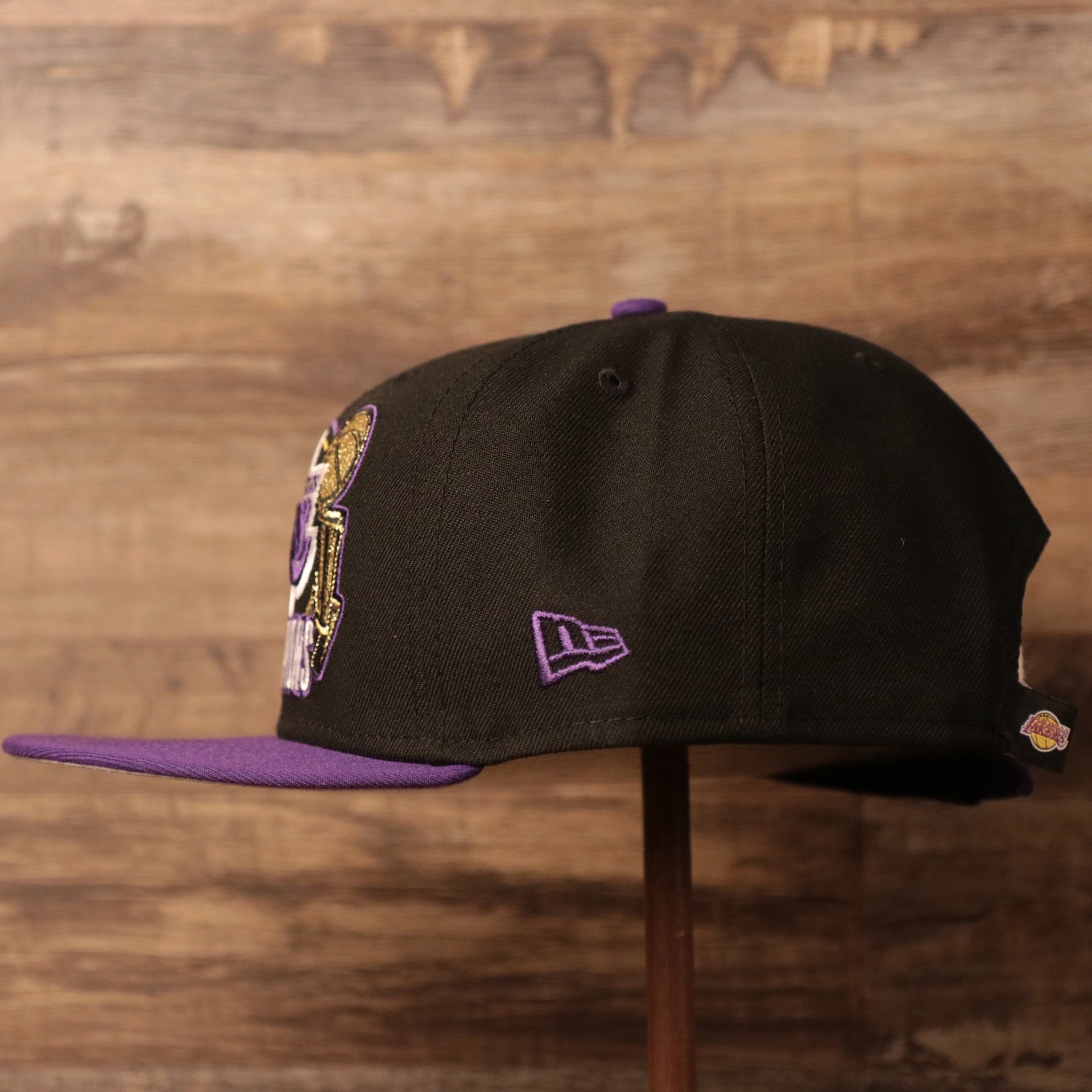 The left side of the black/purple Lakers championship hat 2020.