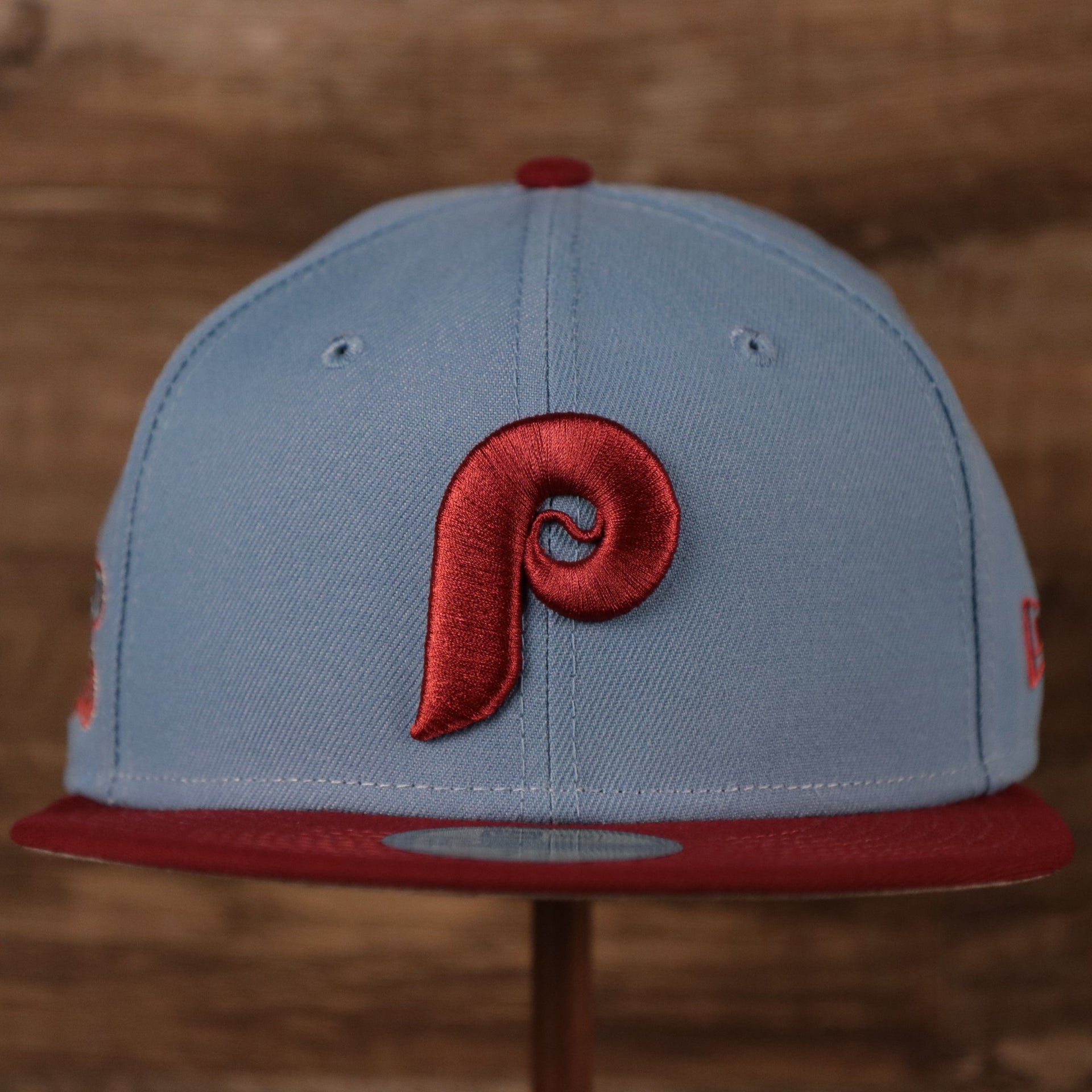 The front side of the ice blue/maroon 1980 World Series Phillies 59fifty fitted hat has the Phillies cooperstown logo in maroon.