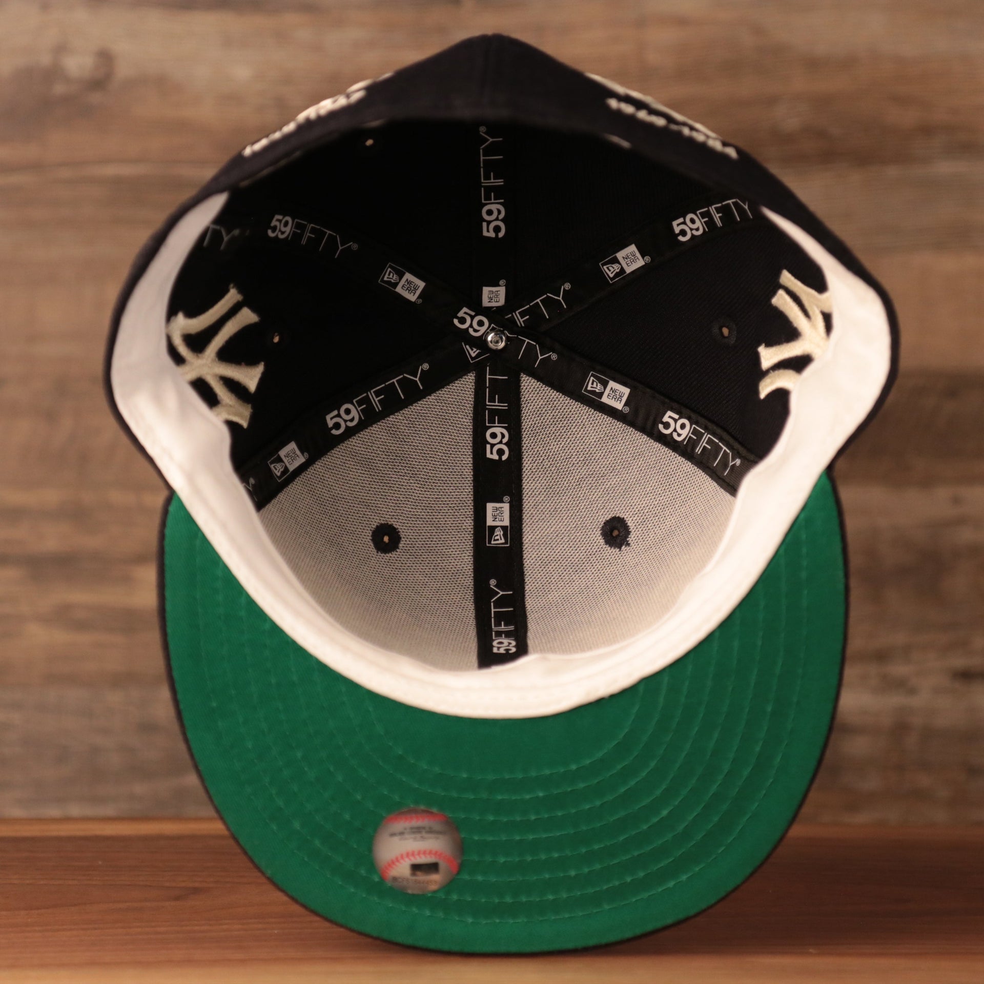 The green underbrim fitted of the New York Yankees 59fifty logo history design by New Era.