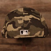 The MLB logo on the back side of the woodland camo 2021 Armed Forces Day hat.