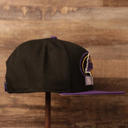 Th wearer's right side of the Lakers champions 2020 snapback hat with gray underbrim.