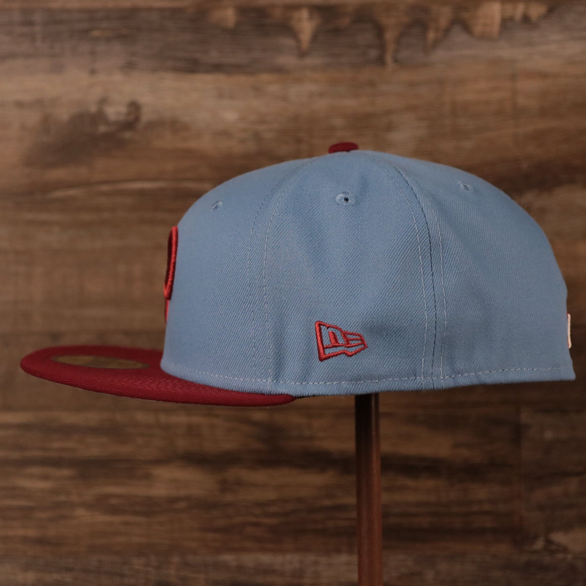 The wearer's left side of the retro Philadelphia Phillies side patch 59fifty fitted cap has the logo of New Era in maroon.