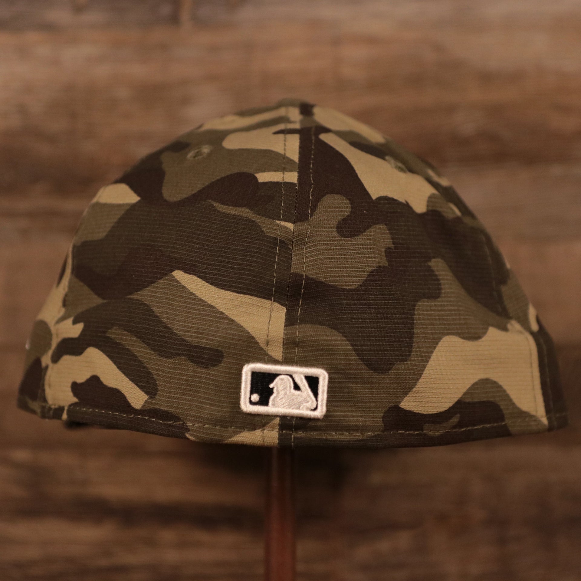 The back side of the New York Yankees 2021 Armed Forces Day 59fifty fitted hat has the MLB logo in white.