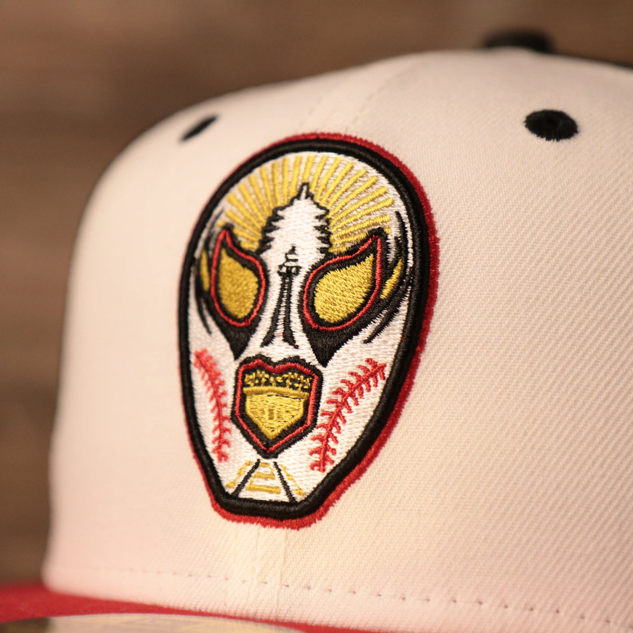 A logo of the luchadores de reading on the front of the luchadores fitted cap by New Era.