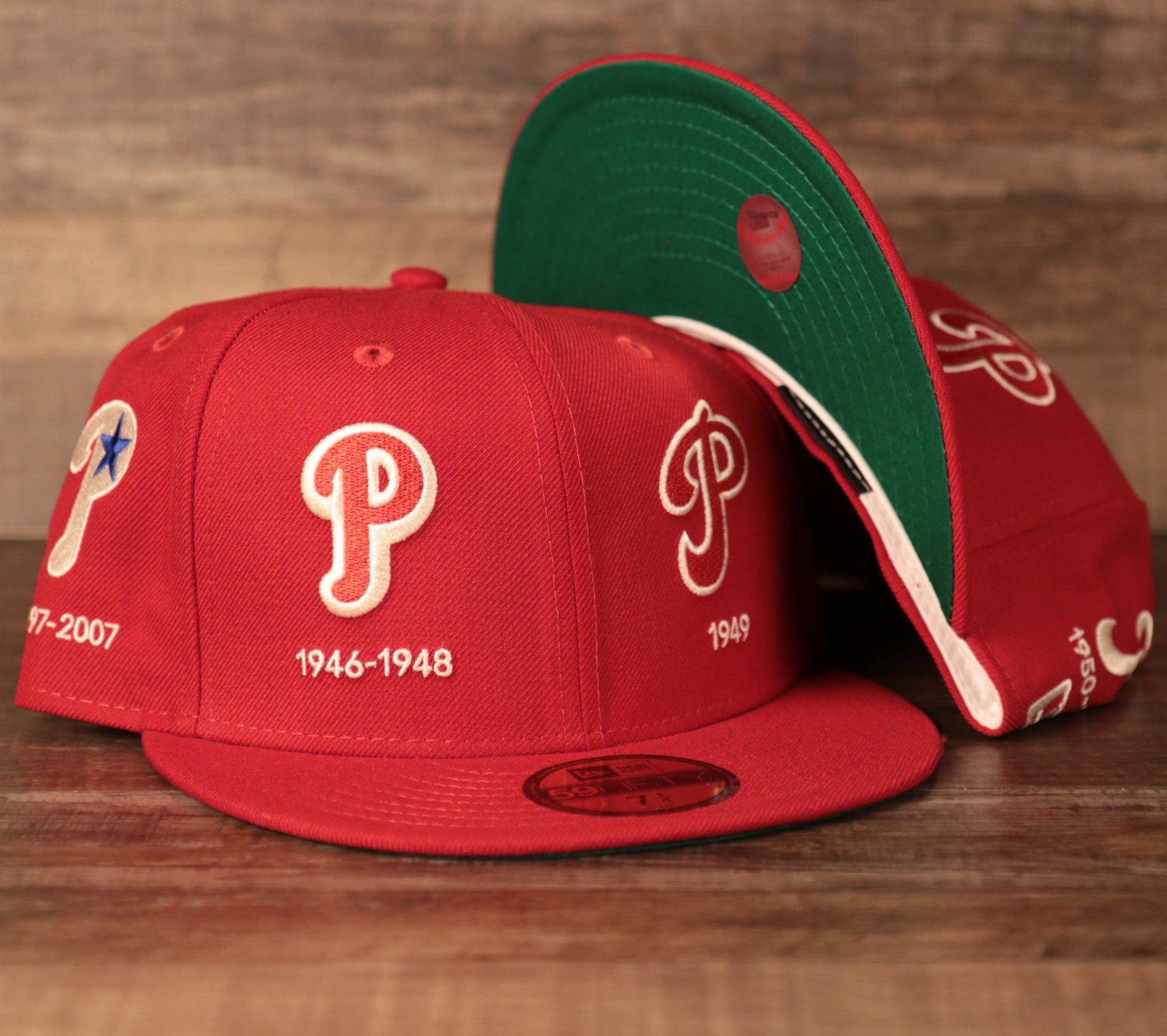 A Phillies red 59fifty with all-over embroidery of the team's logo history designed by New Era.