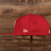 The left side of the red Philadelphia Phillies Philly Cheesesteak 59fifty fitted cap has the logo of New Era in white.