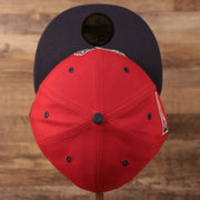 The top view of the crown of the red Lehigh Valley Iron Pigs 5950 fitted cap with the black bottom.