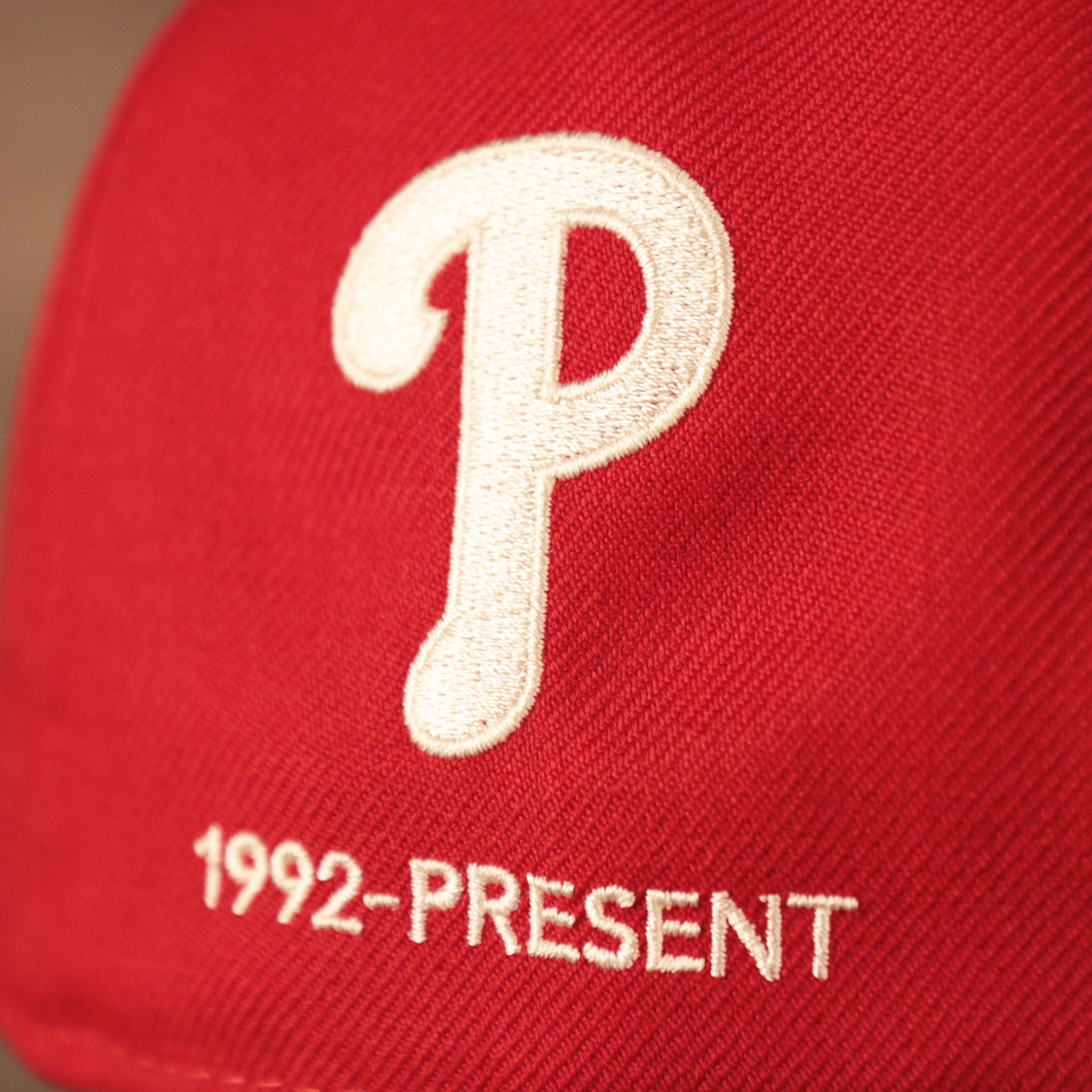 The current Phillies logo on the red old school New Era 59fifty with all over logo history of the team.