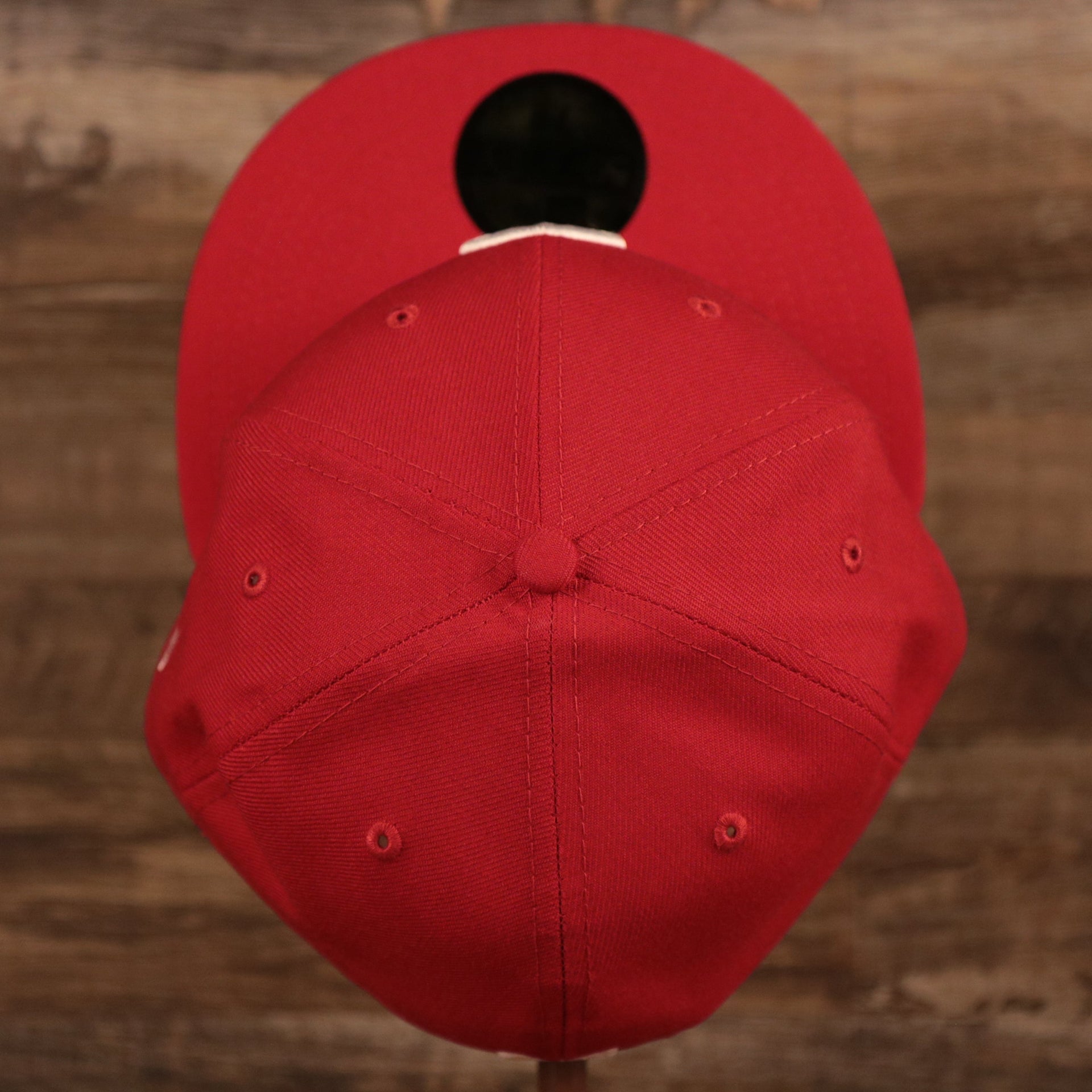 A top look of the crown of the red Philly Cheesesteak side patch fitted hat.