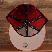 The gray brim fitted red Philly Cheesesteak side patch New Era fitted cap.