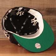 Old school patch fitted hat with the logo history of the Yankees with a green underbrim fitted.