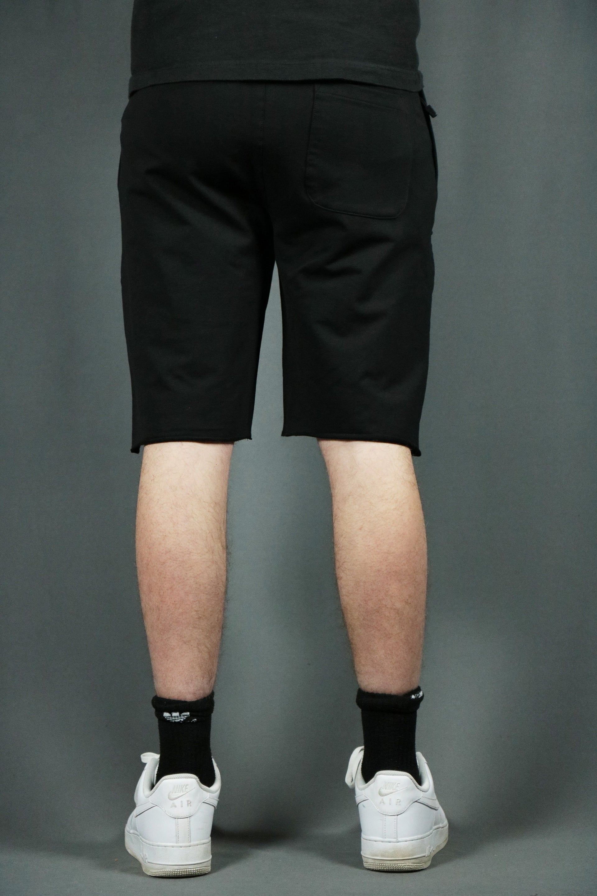 The backside of the black men's french terry shorts by Jordan Craig.