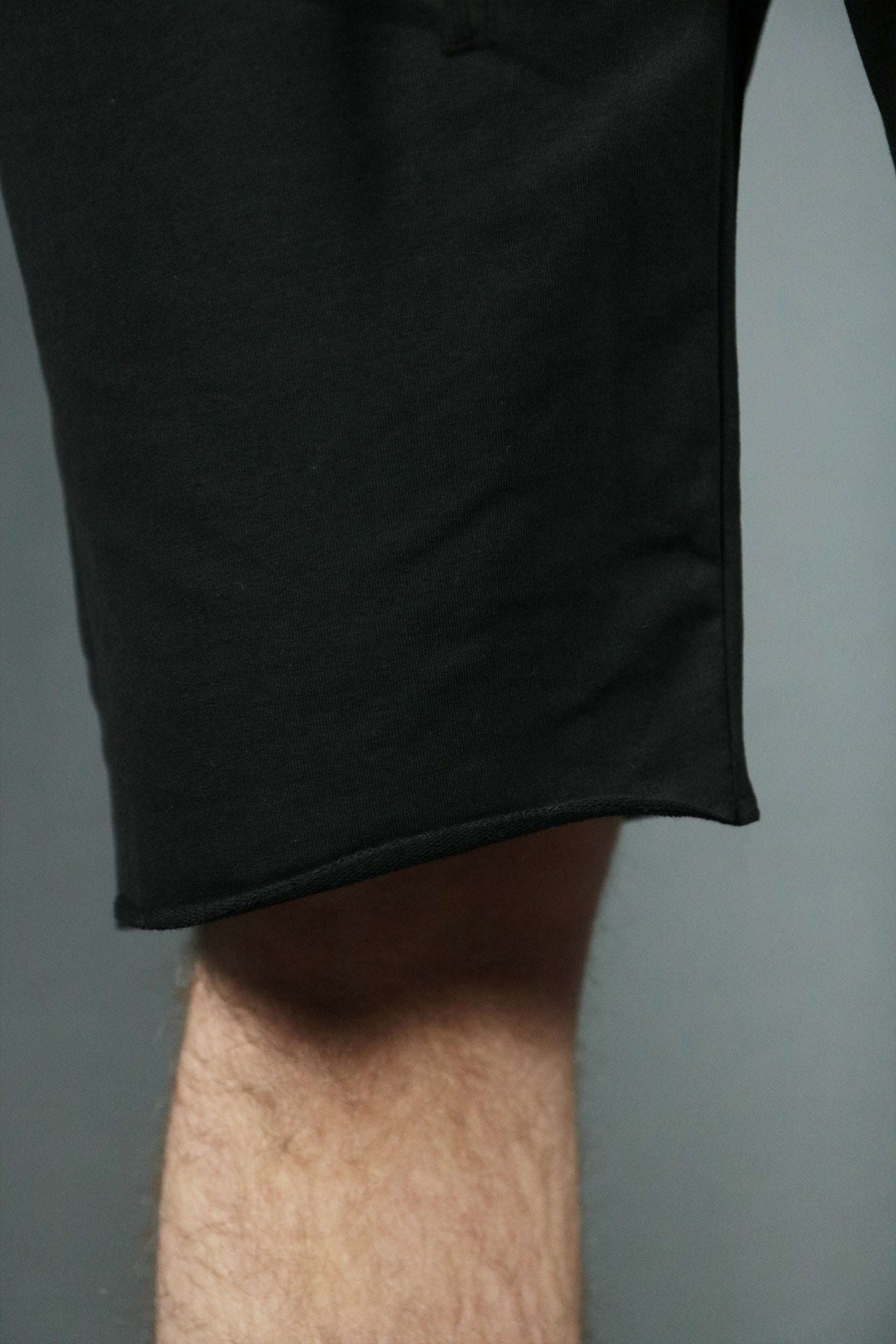 Bottom end of the black men's french terry shorts by Jordan Craig.
