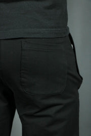 The back pocket of the black mens terry cloth shorts.