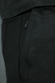 One of the two zipped pockets of the Jordan Craig black french terry shorts.