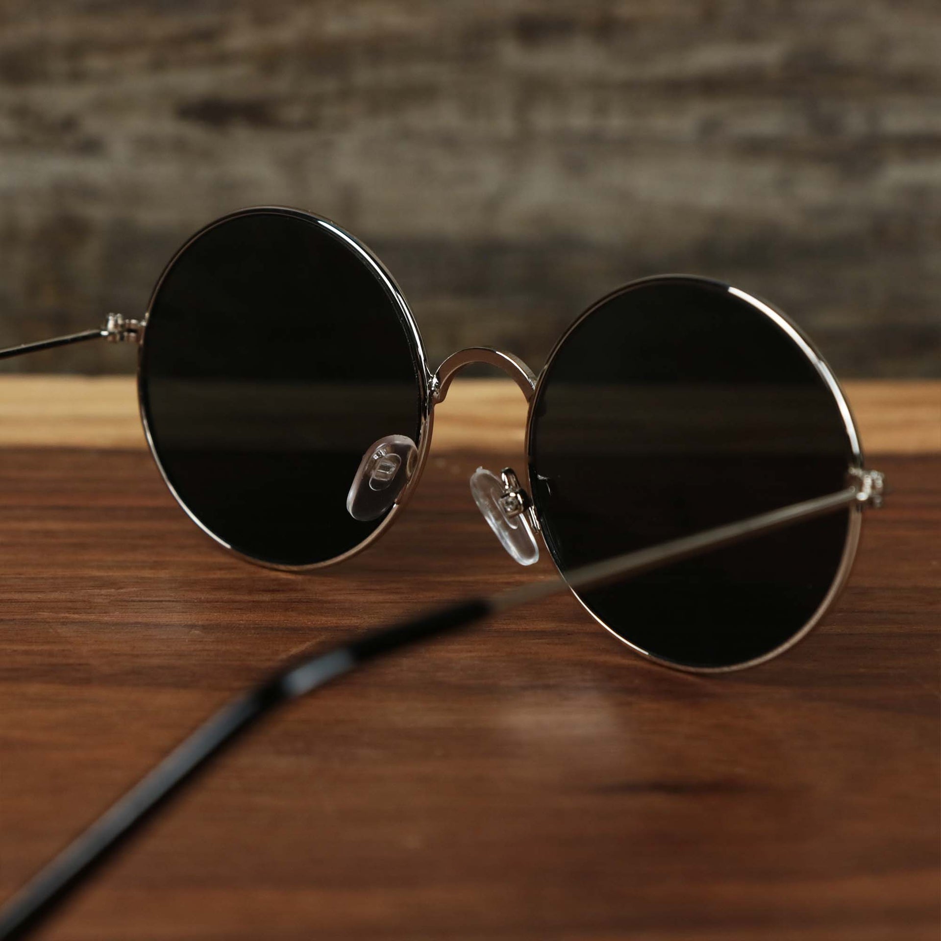 The inside of the Youth Round Frame Black Lens Sunglasses with Silver Frame