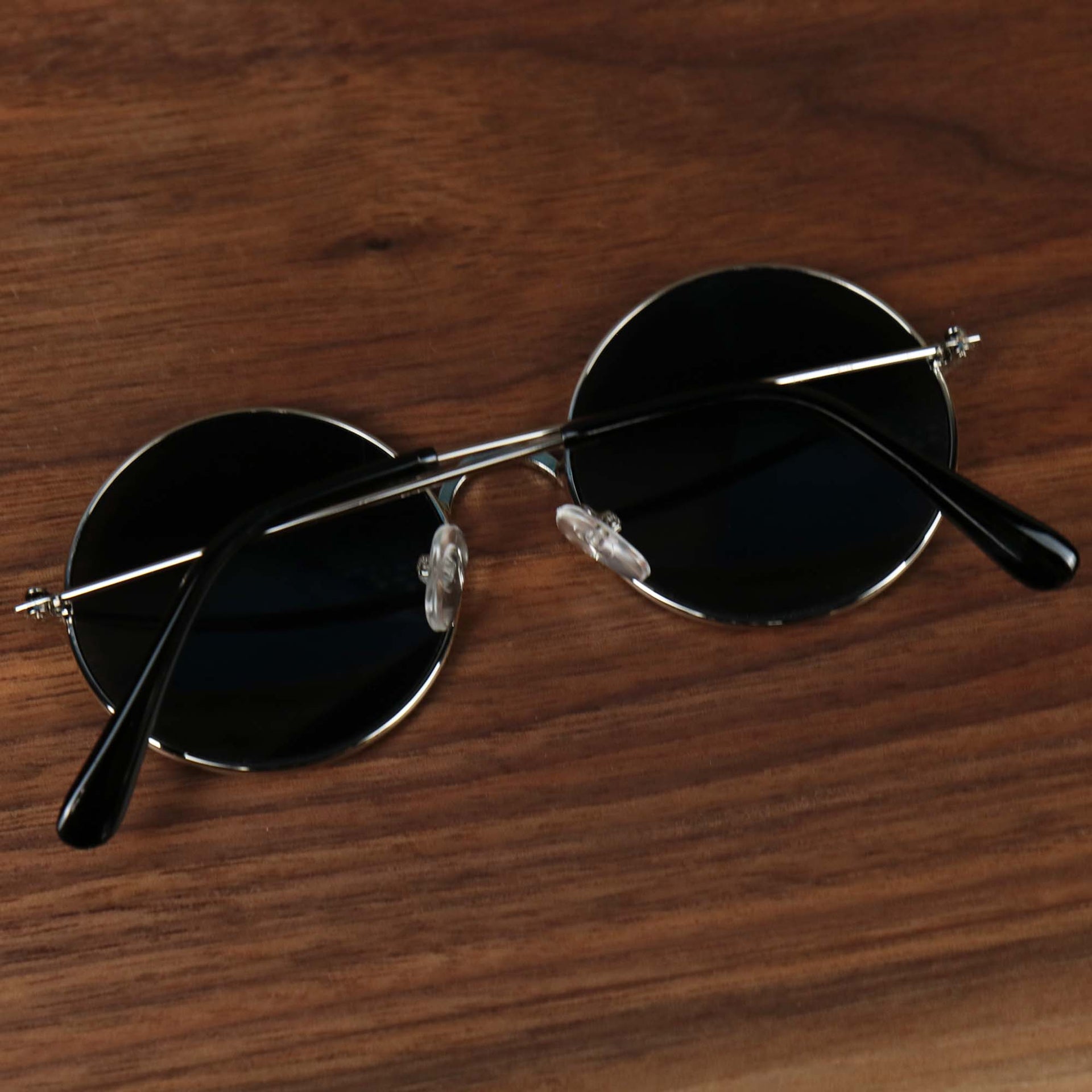 The Youth Round Frame Black Lens Sunglasses with Silver Frame folded up