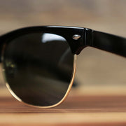 The hinge on the Thick Top and Metal Bottom Frame Black Gradient Lens Sunglasses with Black Frame