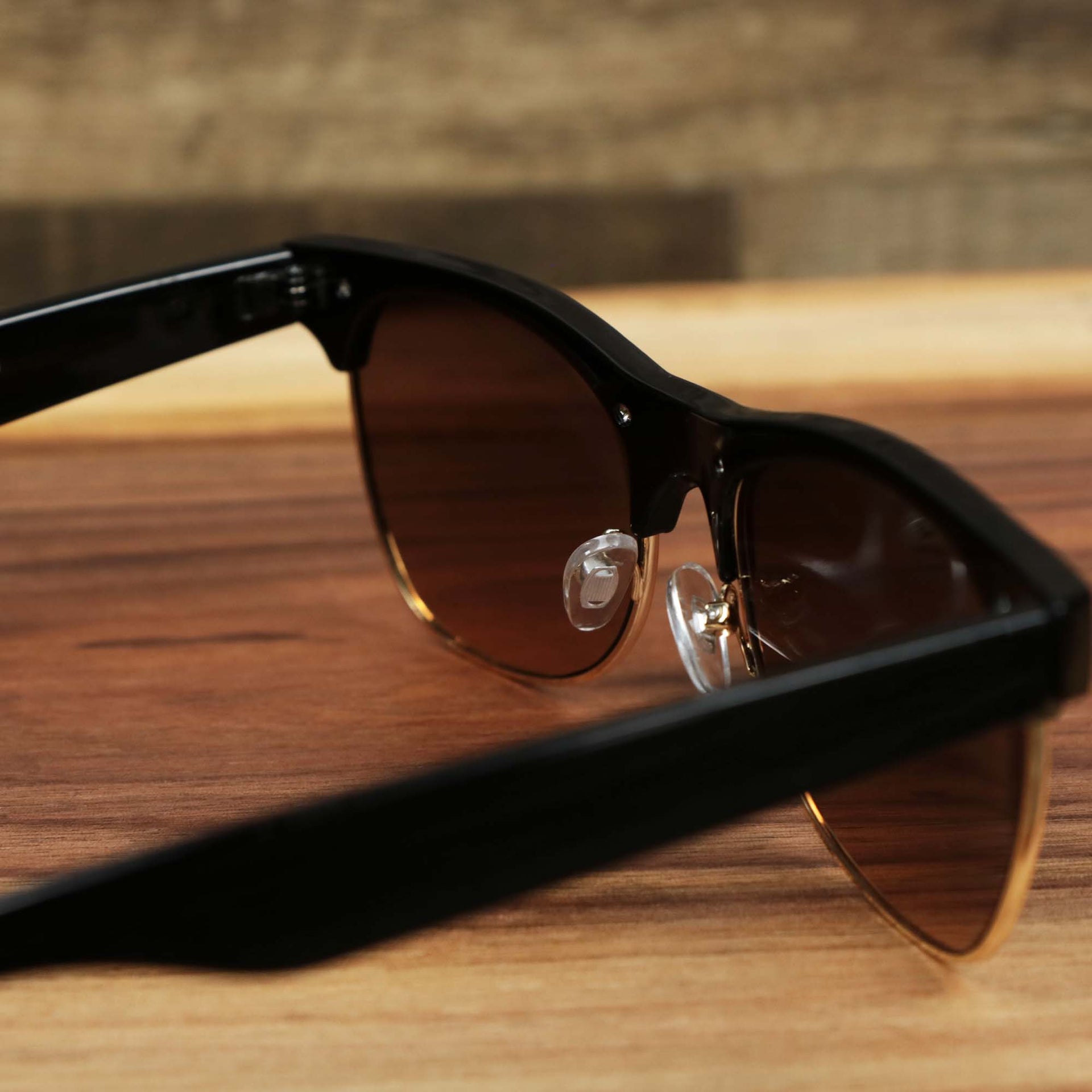 The inside of the Thick Top and Metal Bottom Frame Brown Lens Sunglasses with Black Frame