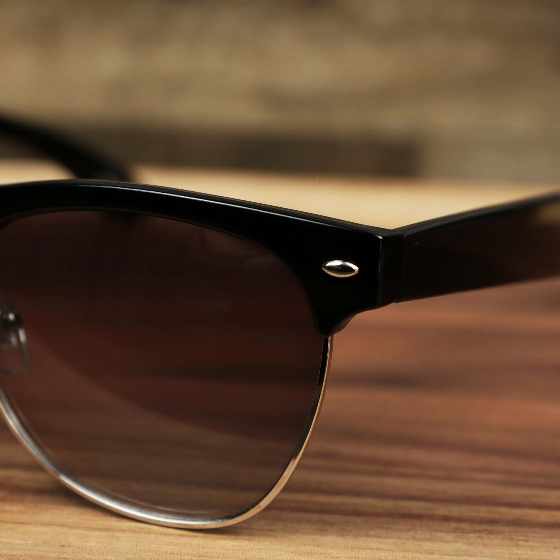 The hinge on the Thick Top and Metal Bottom Frame Black Lens Sunglasses with Black Frame