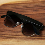 The Thick Top and Metal Bottom Frame Black Lens Sunglasses with Black Frame folded up