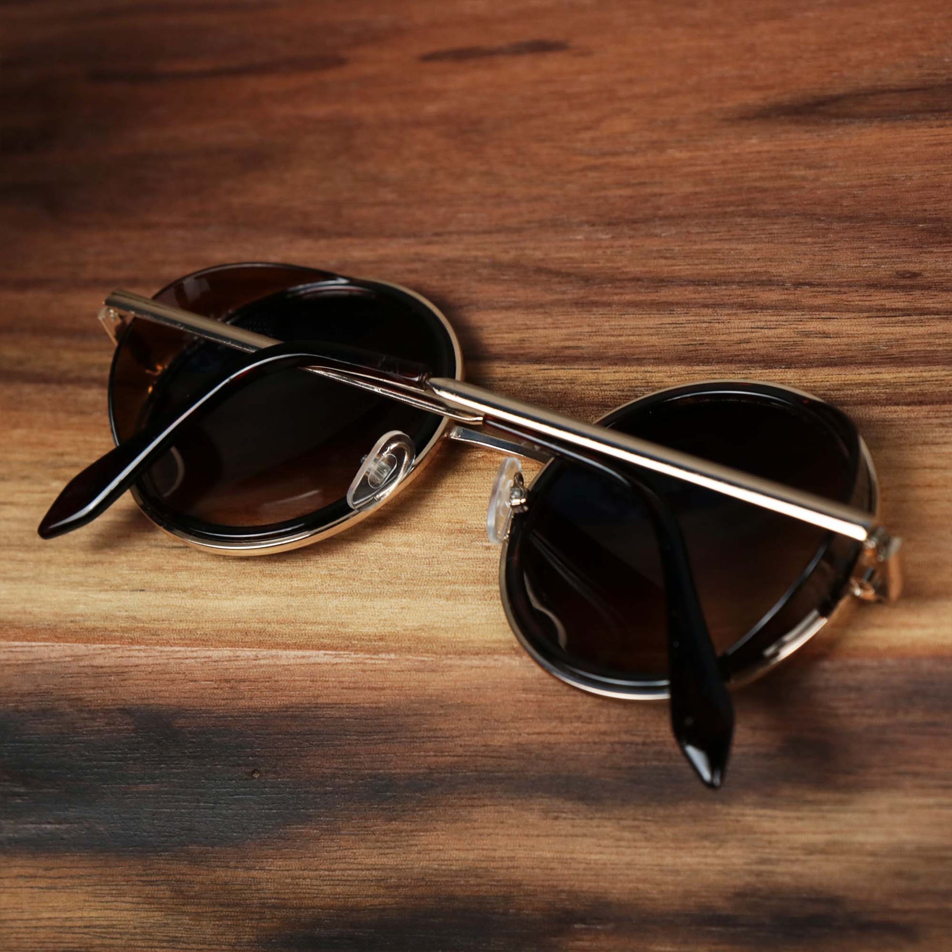 The Circle Frame Brown Lens Sunglasses with Tortoise Frame folded up