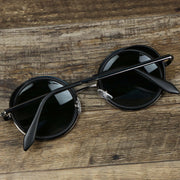 The Circle Frame Black Lens Sunglasses with Black Frame folded up