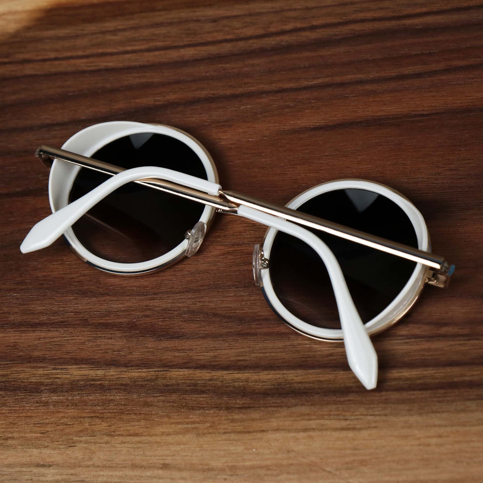 The Circle Frame Black Lens Sunglasses with White Frame folded up