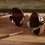 The inside of the Round Frame Arched Bridge Brown Lens Sunglasses with Gold Frame