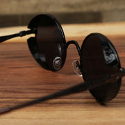 The inside of the Round Frame Arched Bridge Black Lens Sunglasses with Brown Frame