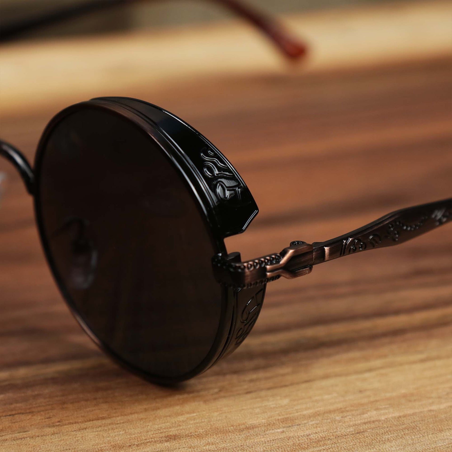 The hinge on the Round Frame Arched Bridge Black Lens Sunglasses with Brown Frame