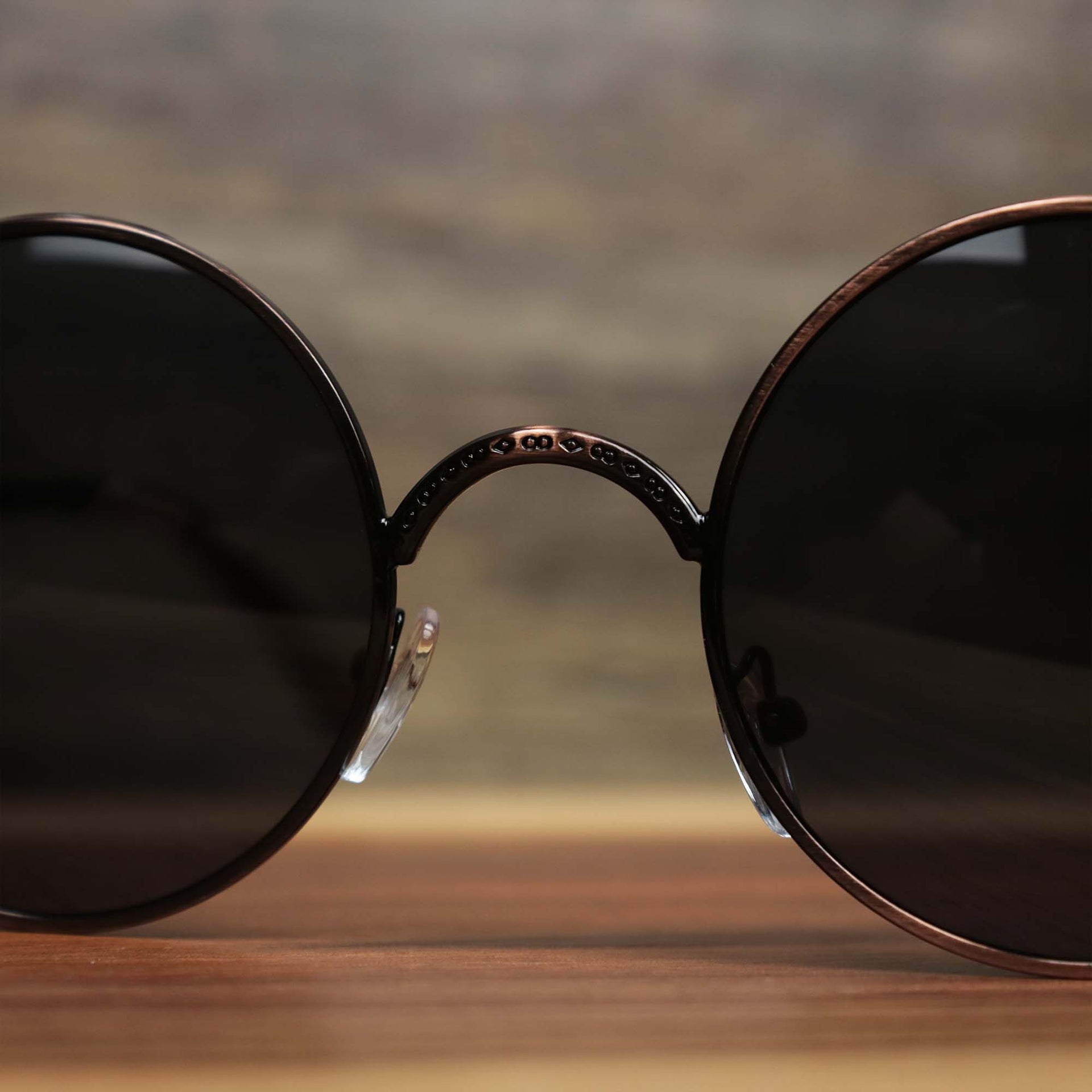 The bridge on the Round Frame Arched Bridge Black Lens Sunglasses with Brown Frame