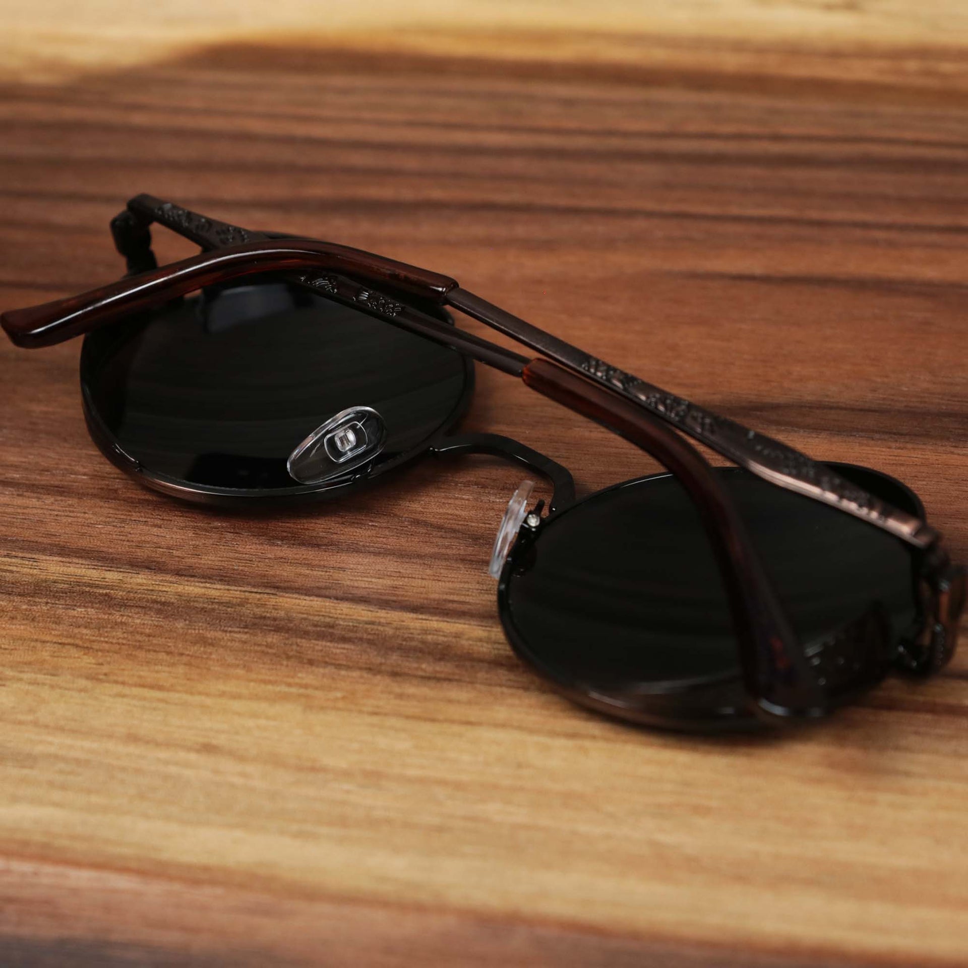 The Round Frame Arched Bridge Black Lens Sunglasses with Brown Frame folded up