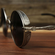 The hinge on the Round Frame Arched Bridge Black Lens Sunglasses with Silver Frame