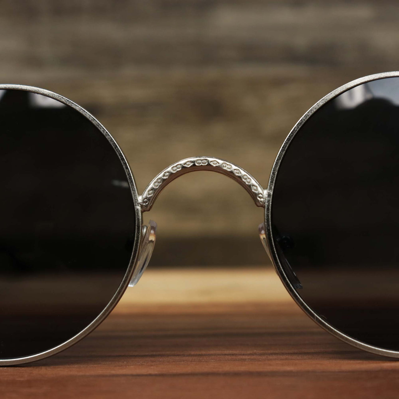The bridge of the Round Frame Arched Bridge Black Lens Sunglasses with Silver Frame