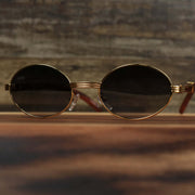 The Oval 3 Row Frame Black Lens Sunglasses with Gold Frame