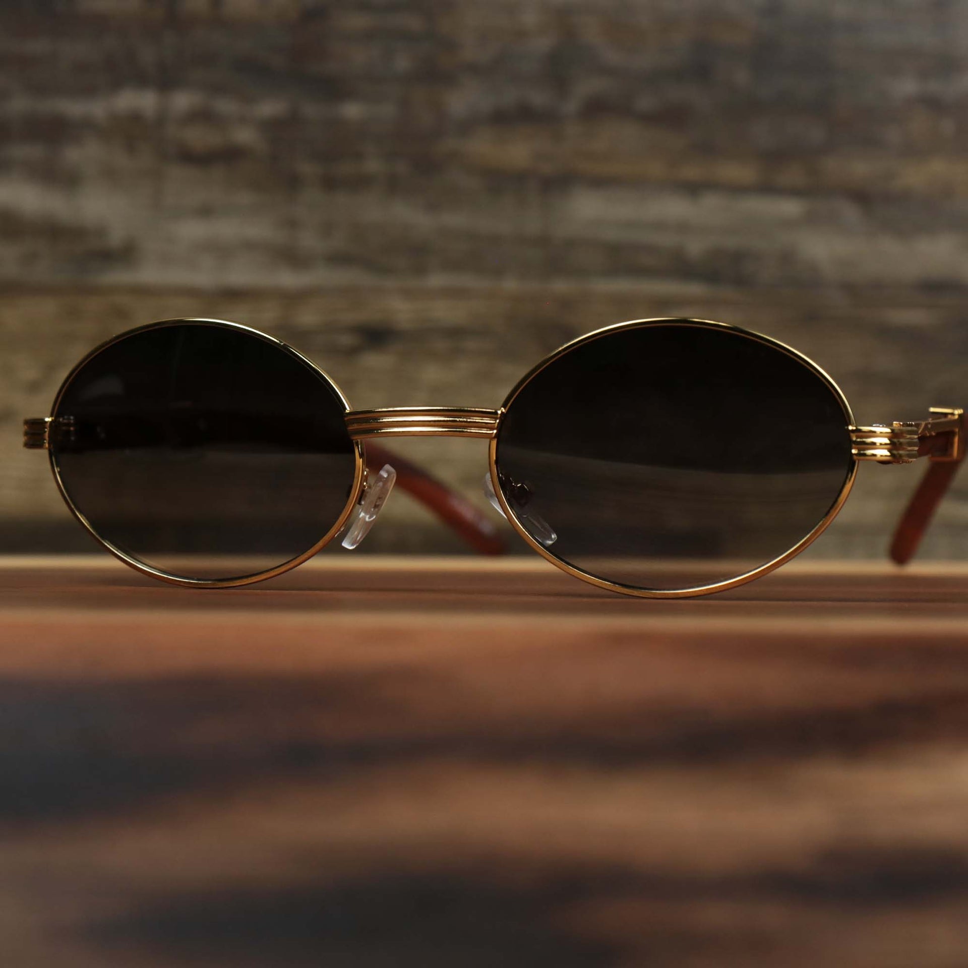 The Oval 3 Row Frame Black Lens Sunglasses with Gold Frame