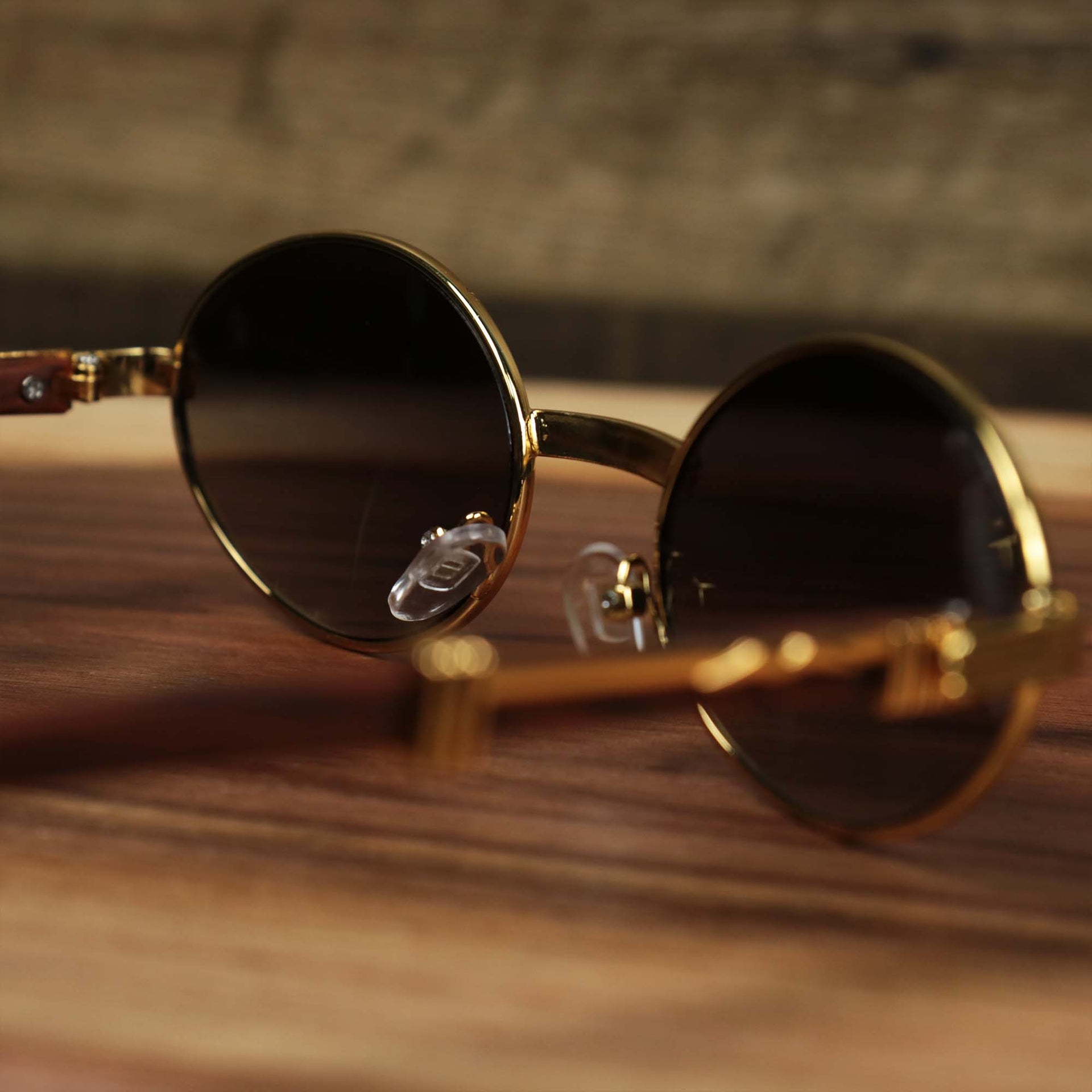 The inside of the Oval 3 Row Frame Black Lens Sunglasses with Gold Frame