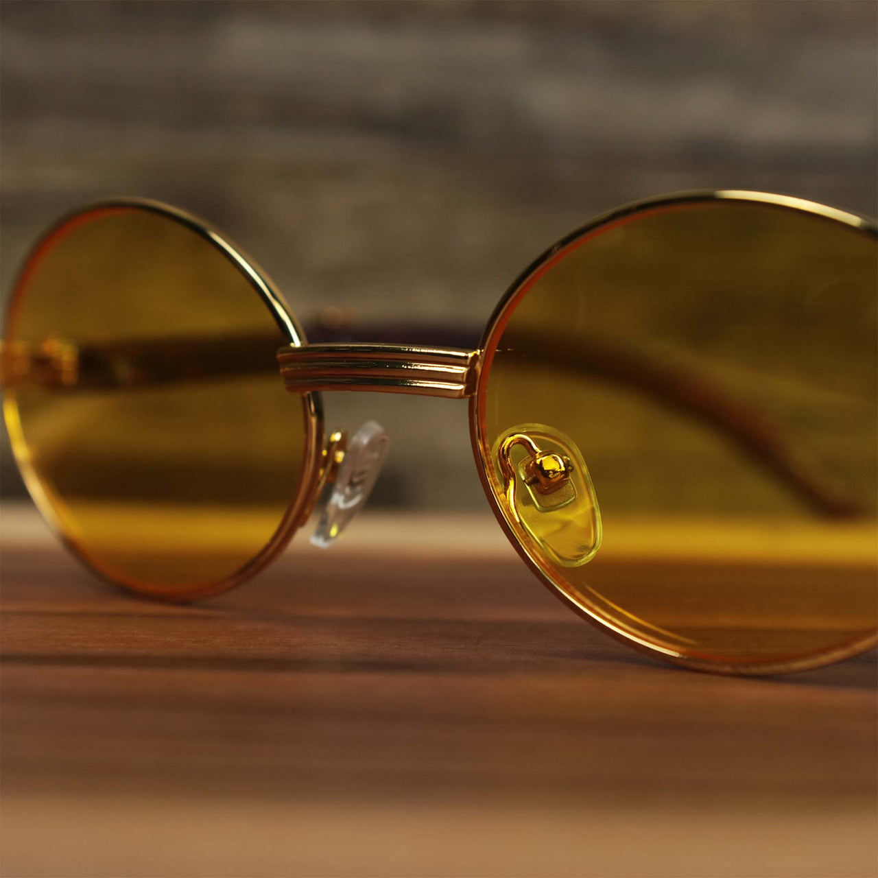 The bridge on the Oval 3 Row Frame Yellow Lens Sunglasses with Gold Frame