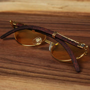 The Oval 3 Row Frame Yellow Lens Sunglasses with Gold Frame folded up