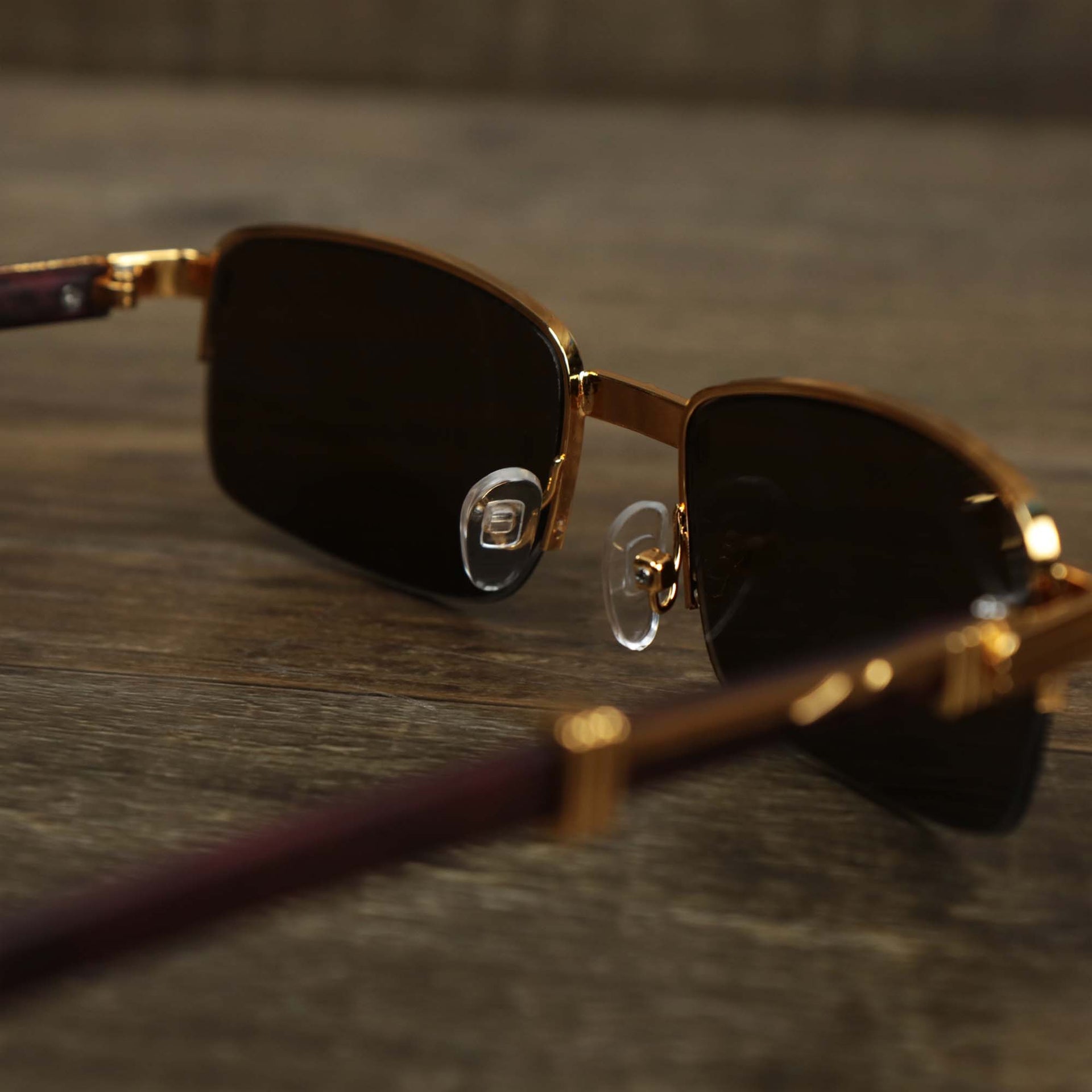 The inside of the Rectangle 3 Row Frame Dark Brown Lens Sunglasses with Gold Frame