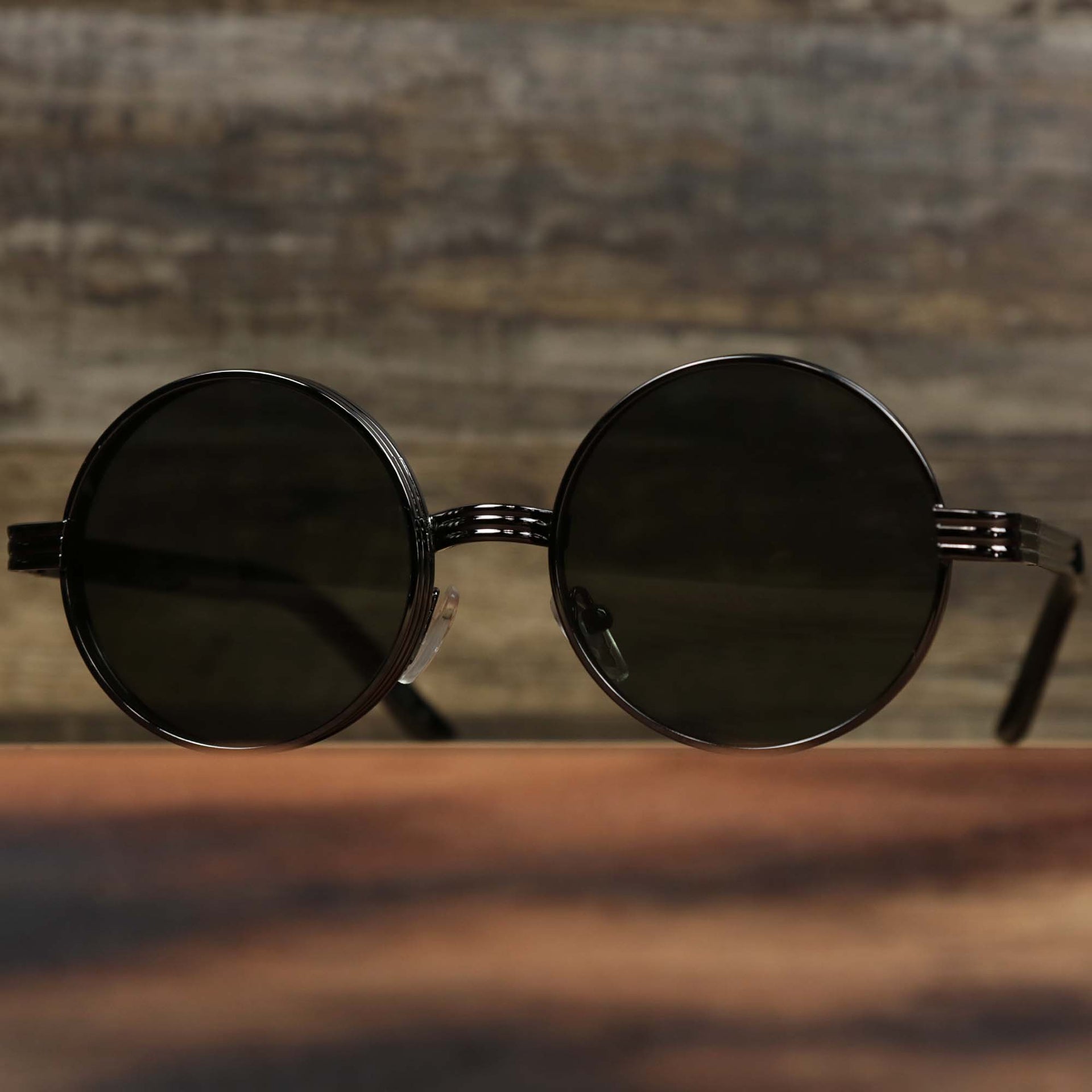 The Round 3 Row Frame Black Lens Sunglasses with Gunmetal Frame