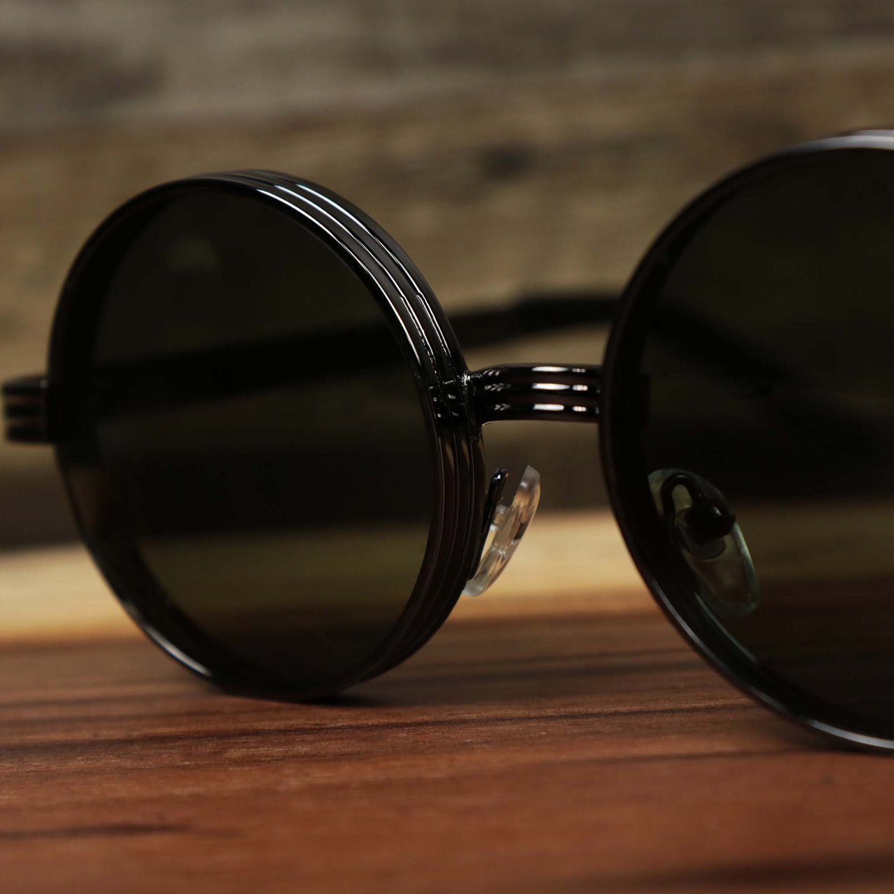 The bridge on the Round 3 Row Frame Black Lens Sunglasses with Gunmetal Frame