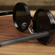 The inside of the Round 3 Row Frame Black Lens Sunglasses with Gunmetal Frame