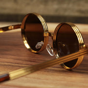 The inside of the Round 3 Row Frame Brown Lens Sunglasses with Gold Frame