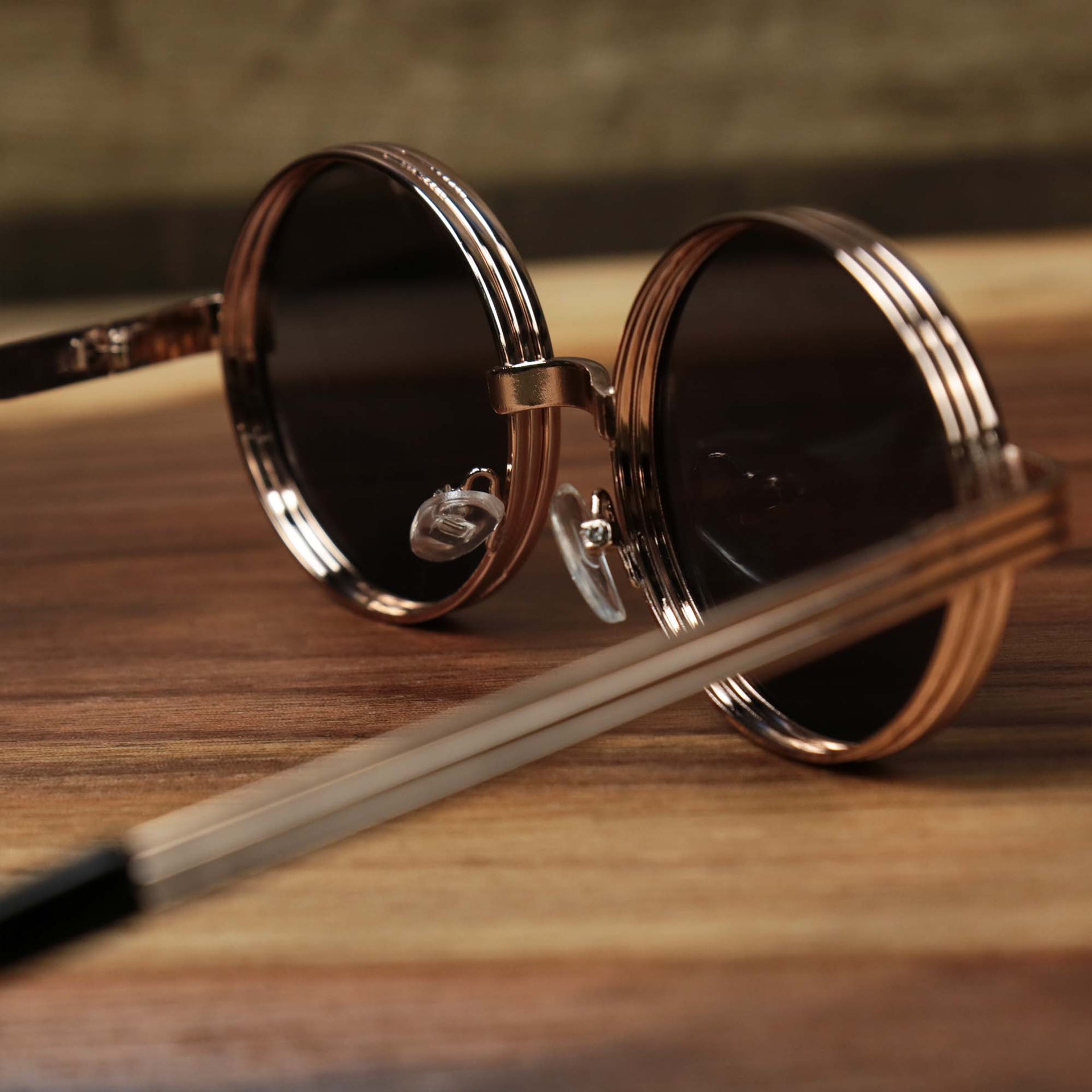 The inside of the Round 3 Row Frame Black Lens Sunglasses with Rose Gold Frame