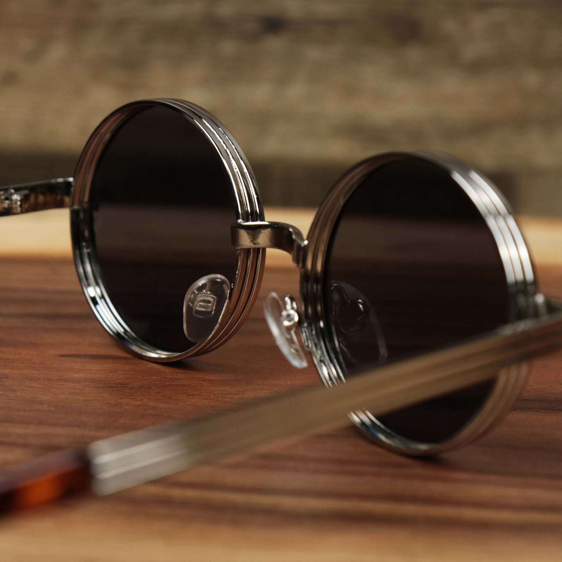 The inside of the Round 3 Row Frame Black Lens Sunglasses with Silver Frame